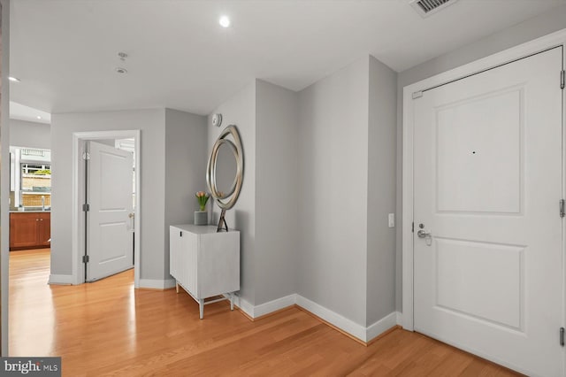 2425 L St NW Unit 623, Washington, DC 20037 - foyer entrance featuring baseboards, light wood finished floors, and recessed lighting