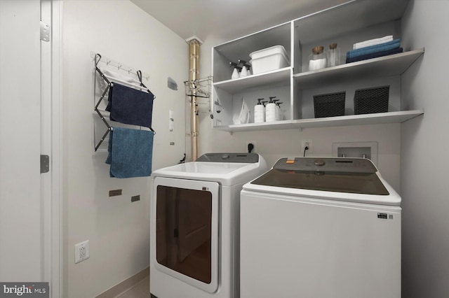 2425 L St NW Unit 623, Washington, DC 20037 - laundry area with washer and dryer