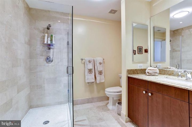 2425 L St NW Unit 623, Washington, DC 20037 - bathroom with a stall shower, toilet, vanity, baseboards, and tile patterned floors