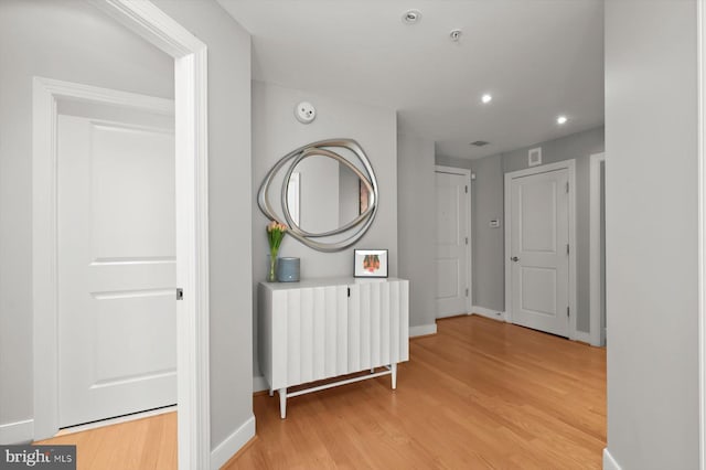 2425 L St NW Unit 623, Washington, DC 20037 - hallway with light wood-style flooring, recessed lighting, and baseboards