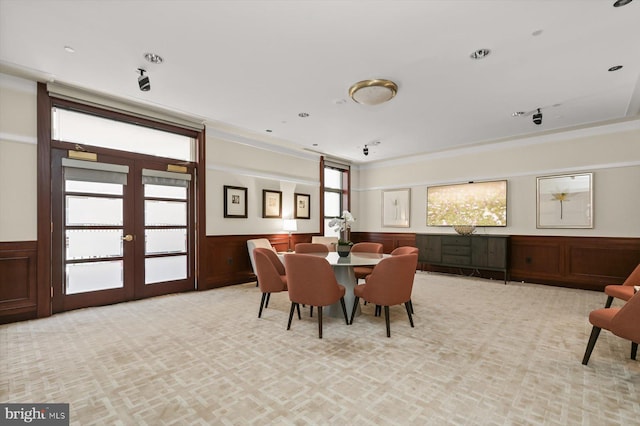 2425 L St NW Unit 623, Washington, DC 20037 - dining area with french doors, wainscoting, light carpet, and crown molding