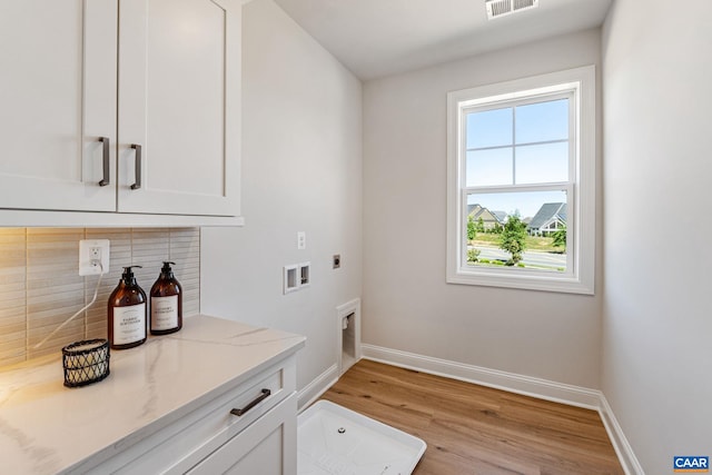 49F Fowler St, Charlottesville, VA 22901 - laundry room featuring hookup for an electric dryer, cabinet space, baseboards, light wood-style floors, and washer hookup