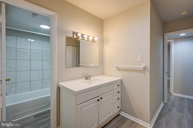 5241 W Running Brook Rd Unit 302, Columbia, MD 21044 - full bathroom with wood finished floors, vanity, baseboards, and shower / bathtub combination