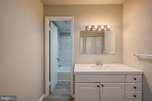 5241 W Running Brook Rd Unit 302, Columbia, MD 21044 - full bathroom with vanity, wood finished floors, and baseboards