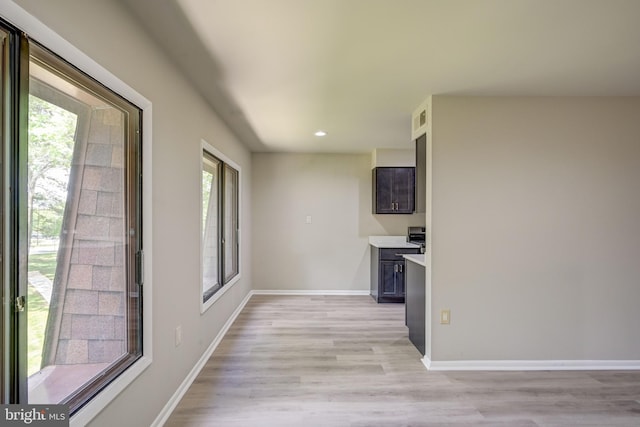 5241 W Running Brook Rd Unit 302, Columbia, MD 21044 - kitchen featuring light wood-style flooring, recessed lighting, baseboards, and light countertops