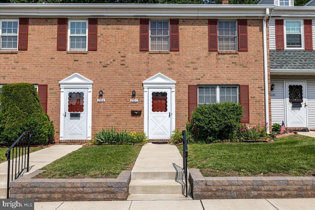2527 Devonshire Ct, Lansdale, PA 19446 - townhome / multi-family property with brick siding and a front yard