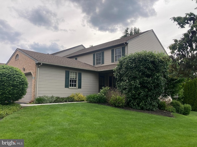 180 Oak Ridge Ln Unit 180, Dallastown, PA 17313 - view of front facade featuring a garage, a front lawn, and a shingled roof