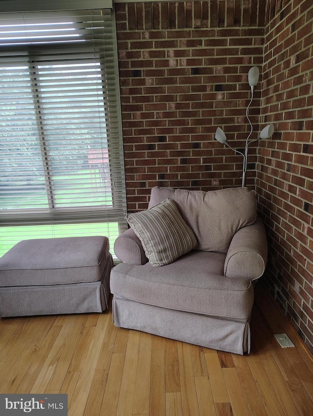 1412 Albert Dr, Bowie, MD 20721 - sitting room featuring brick wall and wood-type flooring