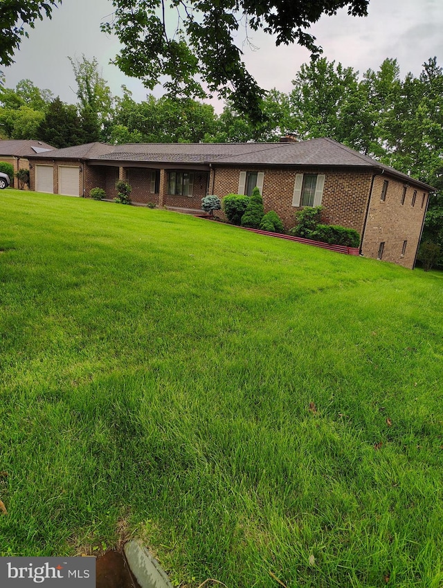 1412 Albert Dr, Bowie, MD 20721 - ranch-style home with brick siding, a front yard, an attached garage, and a chimney