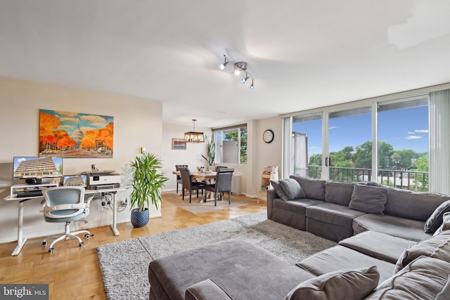 4343 Cherry Hill Rd Unit 601, Arlington, VA 22207 - living area featuring a chandelier and baseboards