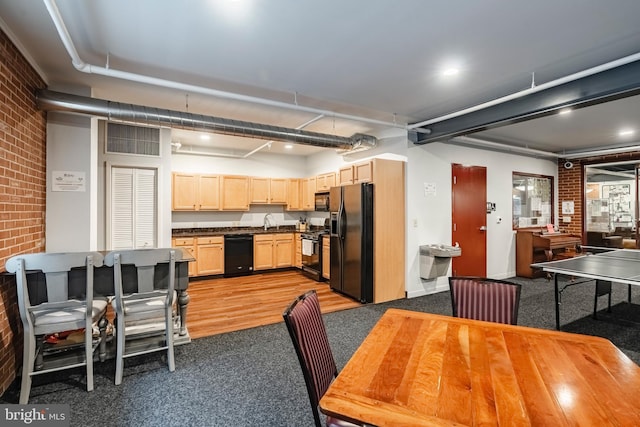 11 W 2nd St Unit 130, Bethlehem, PA 18015 - dining space featuring brick wall and carpet flooring