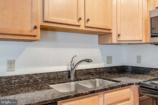 11 W 2nd St Unit 130, Bethlehem, PA 18015 - kitchen with a sink, light brown cabinets, stainless steel microwave, and dark stone countertops