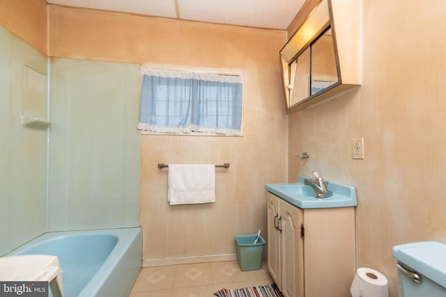 113 N Highland Ave, Baltimore, MD 21224 - full bath featuring toilet, vanity, and tile patterned floors
