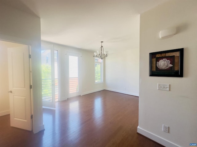 2112 Kober Way, Charlottesville, VA 22901 - empty room featuring a chandelier, baseboards, and dark wood finished floors