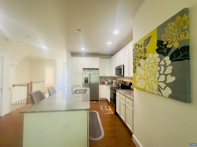 2112 Kober Way, Charlottesville, VA 22901 - kitchen featuring appliances with stainless steel finishes, a sink, white cabinets, a kitchen island with sink, and recessed lighting