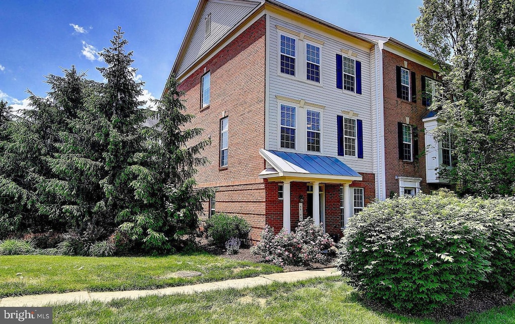 46246 Milthorn Ter, Sterling, VA 20165 - view of front of home with brick siding and a front yard