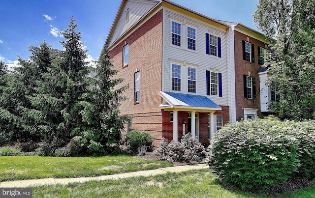 46246 Milthorn Ter, Sterling, VA 20165 - view of front of home with brick siding and a front yard