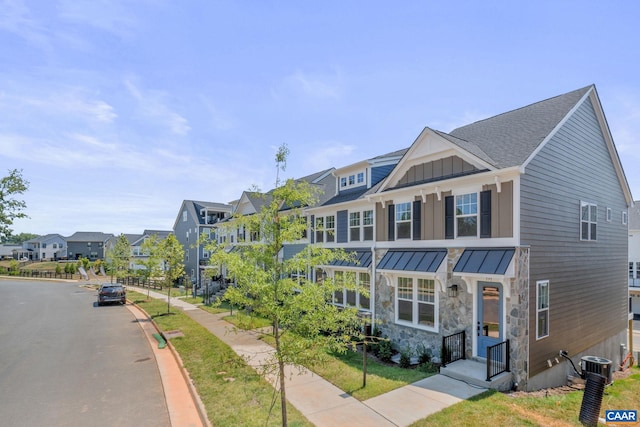 80A Park Ridge Dr, Crozet, VA 22932 - view of front of house with a residential view, a standing seam roof, board and batten siding, central AC unit, and metal roof