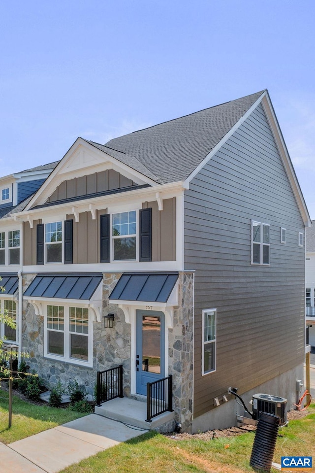 80A Park Ridge Dr, Crozet, VA 22932 - view of front of house with a standing seam roof, central AC, stone siding, and roof with shingles