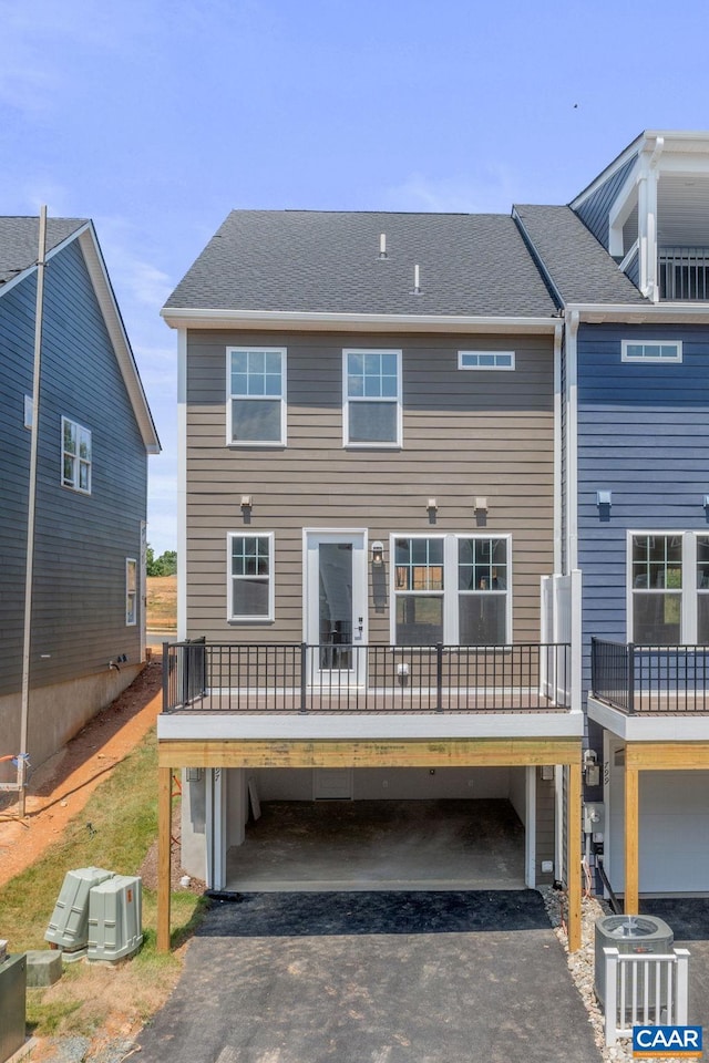 80A Park Ridge Dr, Crozet, VA 22932 - back of property featuring a carport, asphalt driveway, and central AC unit
