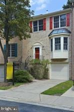 12027 Saw Mill Ct, Silver Spring, MD 20902 - view of front facade featuring concrete driveway and a garage