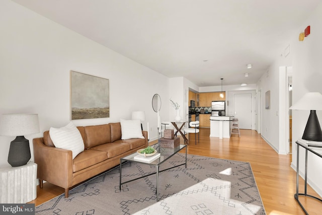 475 K St NW Unit 906, Washington, DC 20001 - living room featuring light wood-type flooring and baseboards