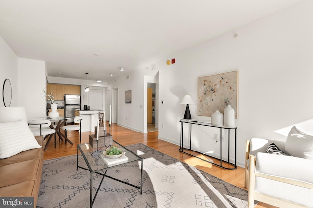 475 K St NW Unit 906, Washington, DC 20001 - living room featuring light wood-style flooring