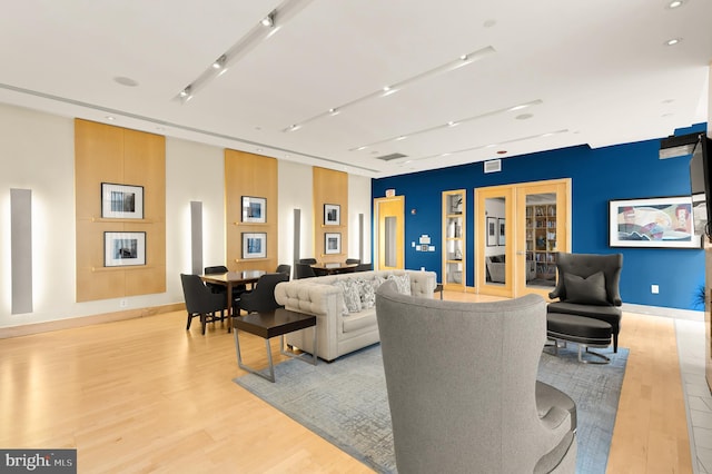 475 K St NW Unit 906, Washington, DC 20001 - living room featuring light wood-type flooring, french doors, and baseboards