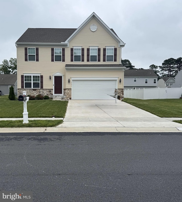 504 S Regulator Dr S, Cambridge, MD 21613 - view of front of house with stone siding, driveway, and an attached garage