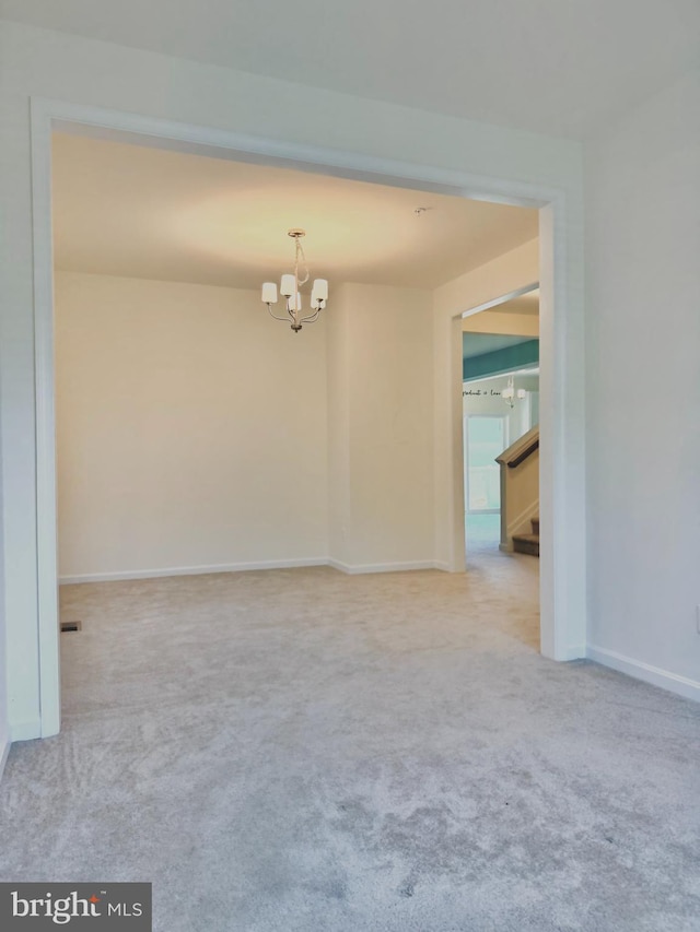 504 S Regulator Dr S, Cambridge, MD 21613 - carpeted spare room featuring a chandelier, baseboards, and stairway