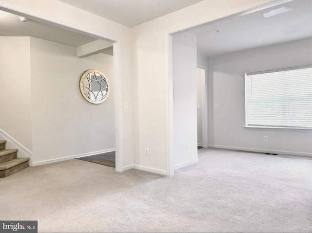 504 S Regulator Dr S, Cambridge, MD 21613 - spare room with carpet floors, baseboards, and stairway