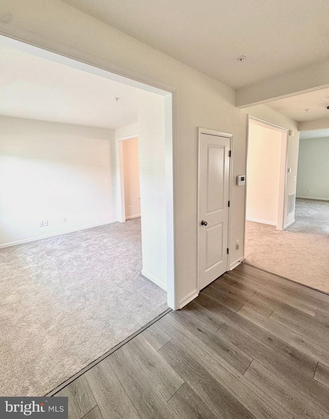 504 S Regulator Dr S, Cambridge, MD 21613 - spare room with carpet flooring, wood finished floors, and baseboards