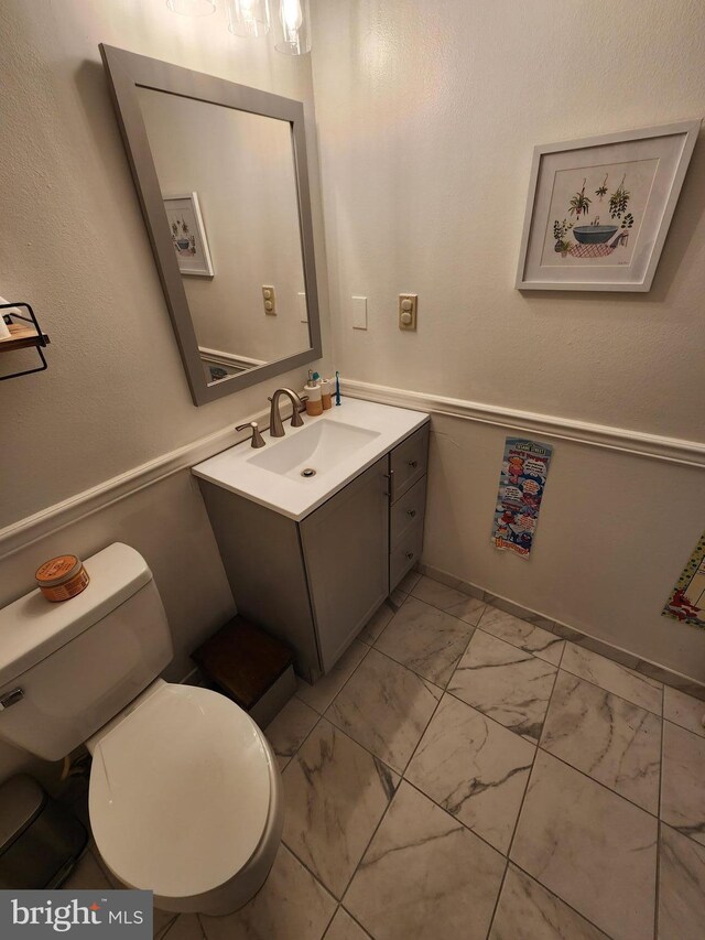 87 Summers St, Inwood, WV 25428 - half bathroom with marble finish floors, vanity, and toilet