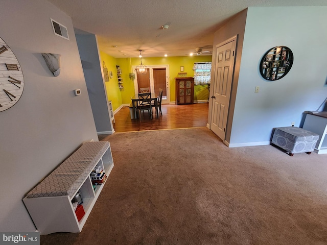 87 Summers St, Inwood, WV 25428 - hallway featuring carpet, a chandelier, and baseboards