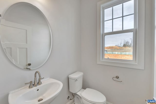 750 Park Ridge Dr, Crozet, VA 22932 - half bathroom with a sink, healthy amount of natural light, toilet, and baseboards