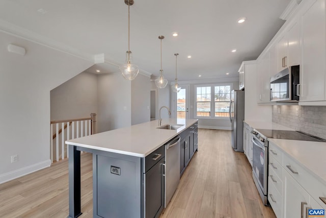 750 Park Ridge Dr, Crozet, VA 22932 - kitchen featuring appliances with stainless steel finishes, a sink, an island with sink, light countertops, and recessed lighting