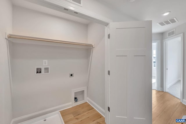 750 Park Ridge Dr, Crozet, VA 22932 - laundry room with hookup for an electric dryer, washer hookup, light wood-style flooring, baseboards, and recessed lighting