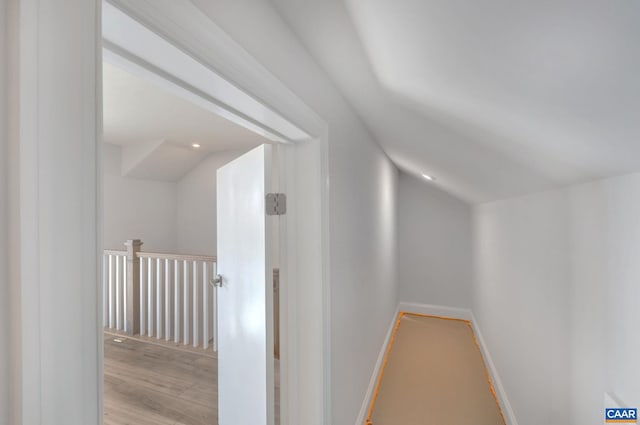 750 Park Ridge Dr, Crozet, VA 22932 - additional living space with wood finished floors, vaulted ceiling, and baseboards