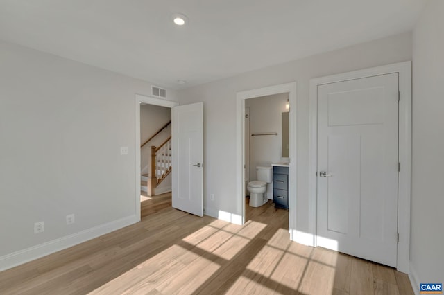 750 Park Ridge Dr, Crozet, VA 22932 - unfurnished bedroom featuring light wood-style floors, baseboards, recessed lighting, and connected bathroom