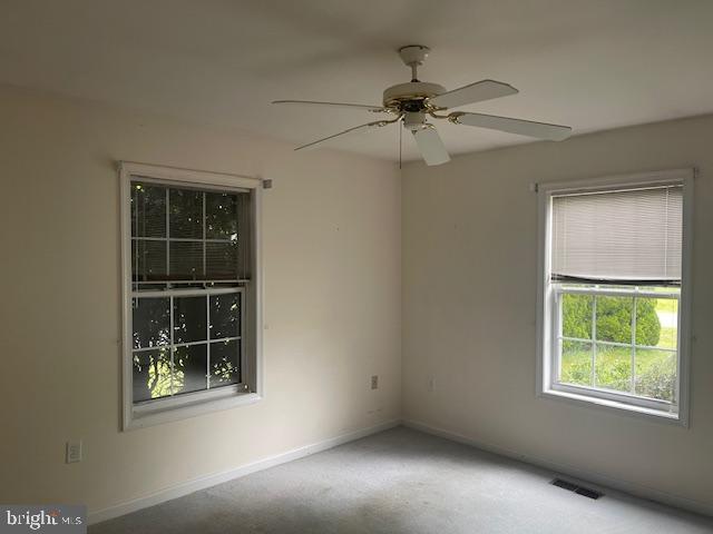8 Love Creek Dr, Lewes, DE 19958 - carpeted spare room featuring baseboards and ceiling fan