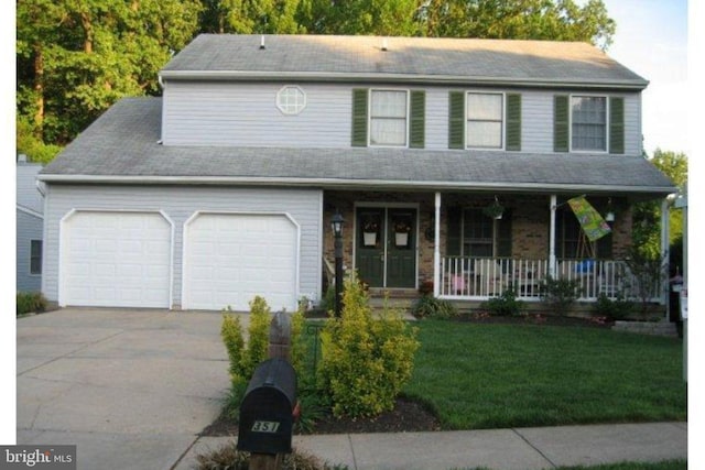 351 Point To Point Rd, Bel Air, MD 21015 - view of front of property with an attached garage, a porch, driveway, and a front yard