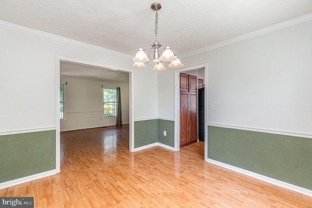 351 Point To Point Rd, Bel Air, MD 21015 - empty room featuring a chandelier, light wood finished floors, ornamental molding, and baseboards