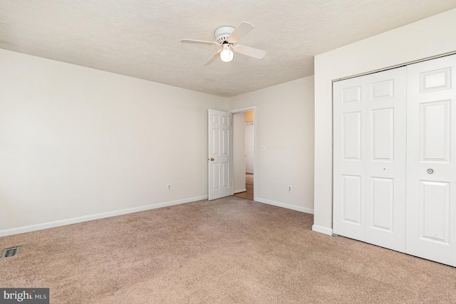 351 Point To Point Rd, Bel Air, MD 21015 - unfurnished bedroom featuring light carpet, baseboards, a closet, a textured ceiling, and a ceiling fan