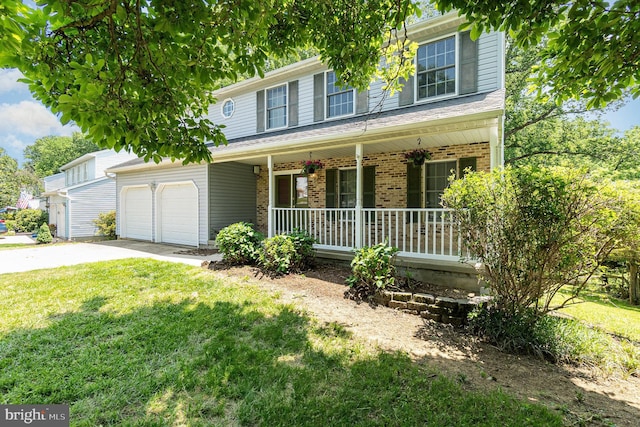 351 Point To Point Rd, Bel Air, MD 21015 - view of front of property with covered porch, a garage, brick siding, a front yard, and driveway