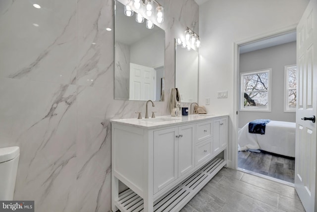 1121 48th Pl NE, Washington, DC 20019 - full bath with double vanity, connected bathroom, and toilet