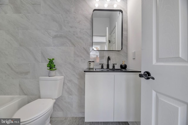1121 48th Pl NE, Washington, DC 20019 - bathroom featuring toilet, vanity, and tile walls