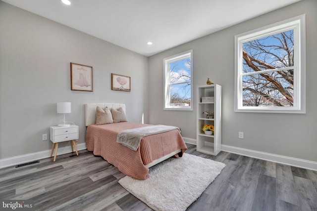 1121 48th Pl NE, Washington, DC 20019 - bedroom with wood finished floors, baseboards, and recessed lighting