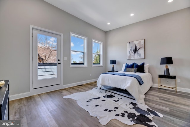 1121 48th Pl NE, Washington, DC 20019 - bedroom with access to exterior, wood finished floors, baseboards, and recessed lighting