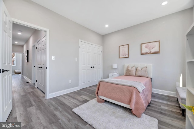 1121 48th Pl NE, Washington, DC 20019 - bedroom with light wood-style flooring, baseboards, recessed lighting, and a closet