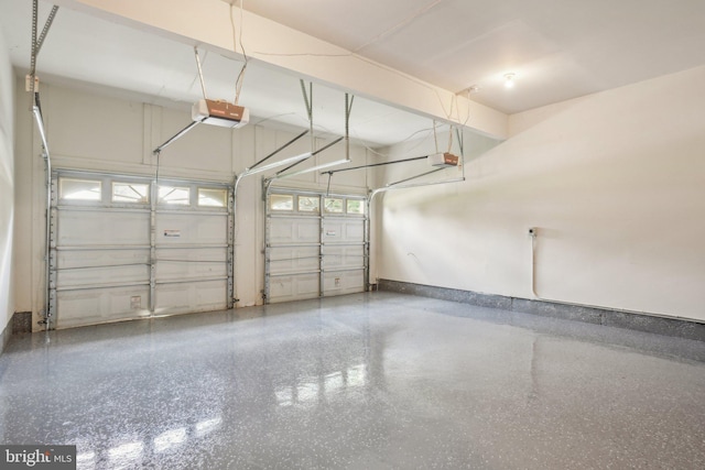 25487 Dabner Dr, Chantilly, VA 20152 - garage featuring a garage door opener and baseboards